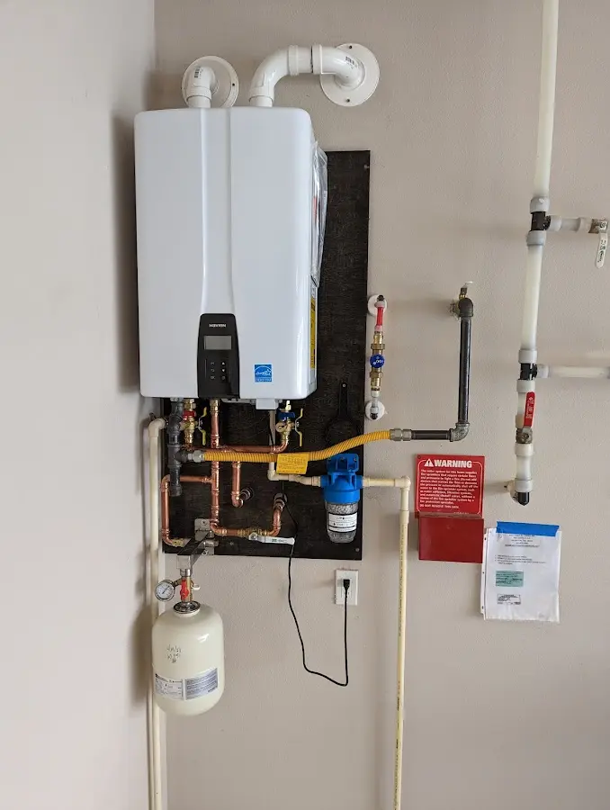 Professional plumber installing copper piping in a Harahan home